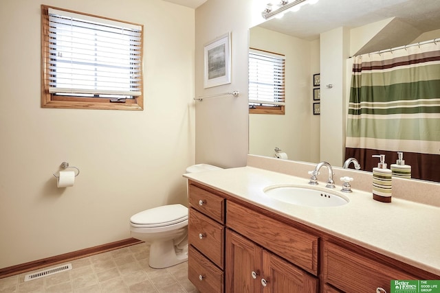 8112 Molokai Dr, Papillion, NE 68046 - bathroom with toilet, vanity, and baseboards