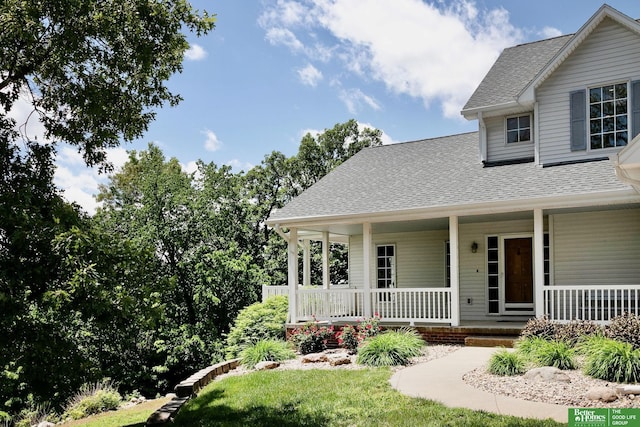 8112 Molokai Dr, Papillion, NE 68046 - view of front of property featuring a shingled roof, a porch, and a front yard