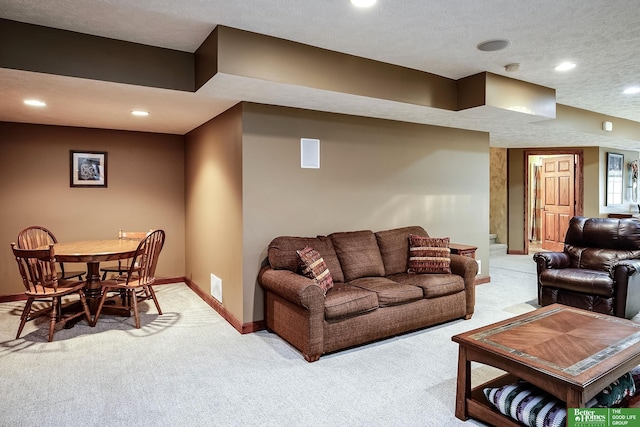 8112 Molokai Dr, Papillion, NE 68046 - living area with light colored carpet, baseboards, recessed lighting, stairs, and a textured ceiling