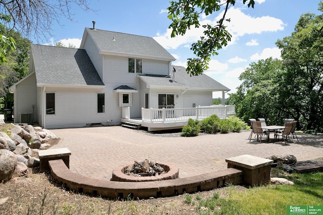 8112 Molokai Dr, Papillion, NE 68046 - rear view of house featuring a patio area, an outdoor fire pit, a deck, and a shingled roof