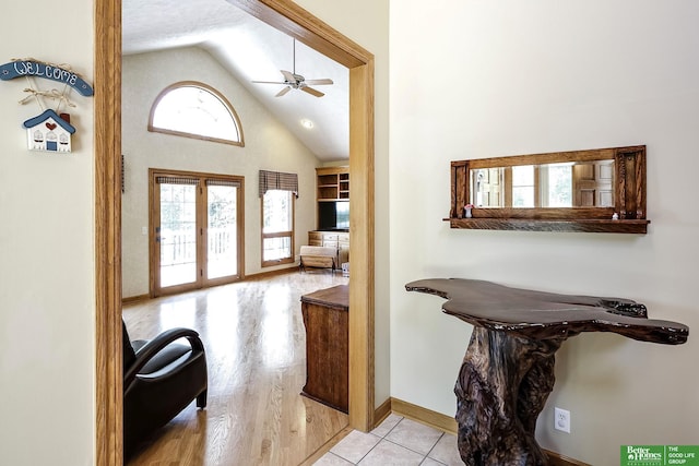 8112 Molokai Dr, Papillion, NE 68046 - entryway featuring a ceiling fan, baseboards, and high vaulted ceiling