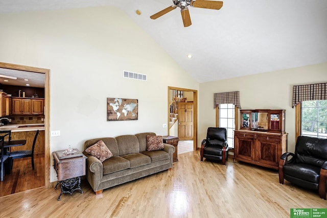 8112 Molokai Dr, Papillion, NE 68046 - living area with high vaulted ceiling, light wood-style floors, a ceiling fan, and recessed lighting