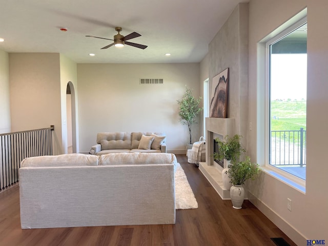 900 Middleton Ave, Lincoln, NE 68521 - living area with arched walkways, ceiling fan, dark wood-style flooring, recessed lighting, and baseboards