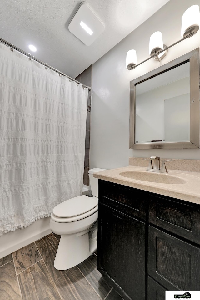 1206 W Ryons St, Lincoln, NE 68522 - full bath featuring vanity, toilet, and shower / bath combo with shower curtain