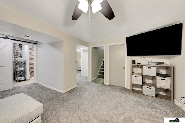 1206 W Ryons St, Lincoln, NE 68522 - unfurnished living room with stairway, carpet, ceiling fan, and baseboards