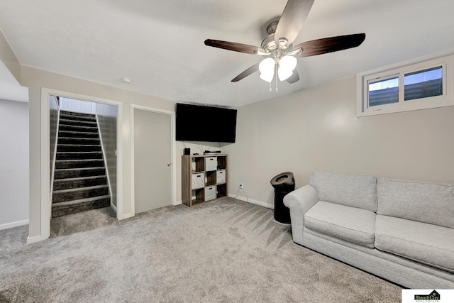 1206 W Ryons St, Lincoln, NE 68522 - living room with baseboards, light carpet, stairway, and a ceiling fan