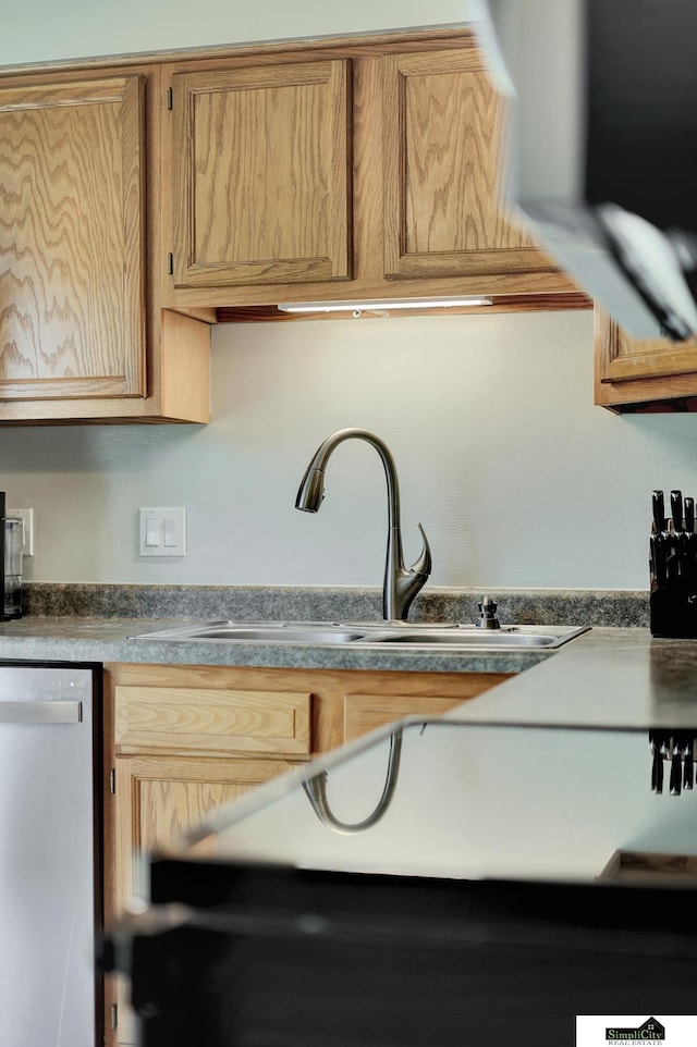 1206 W Ryons St, Lincoln, NE 68522 - kitchen featuring dishwasher, a sink, and dark countertops