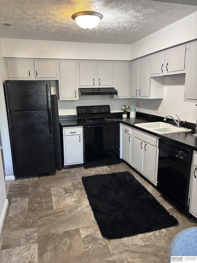 1231 S 121st Plz Unit 312, Omaha, NE 68144 - kitchen with black appliances, a sink, dark countertops, under cabinet range hood, and a textured ceiling