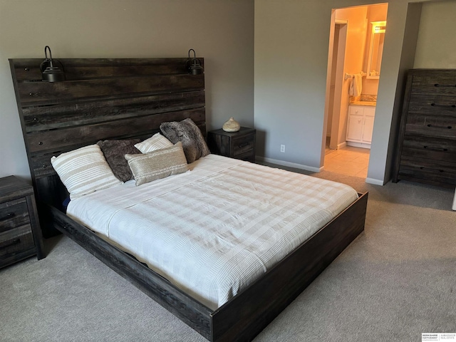 1231 S 121st Plz Unit 312, Omaha, NE 68144 - bedroom featuring carpet flooring, baseboards, and connected bathroom