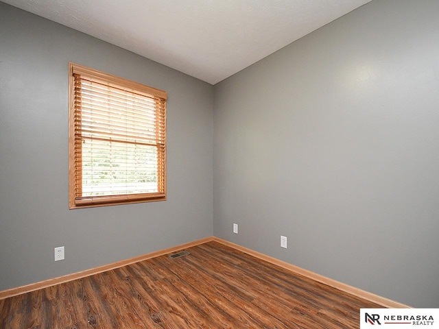 1853 SW 38th St, Lincoln, NE 68522 - unfurnished room featuring baseboards and wood finished floors