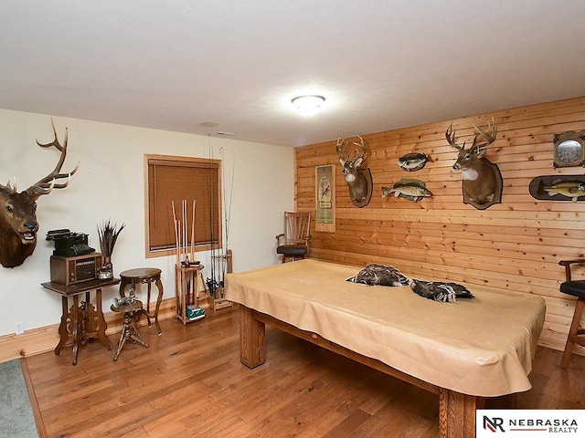 1853 SW 38th St, Lincoln, NE 68522 - playroom with pool table, wood walls, wood finished floors, and baseboards