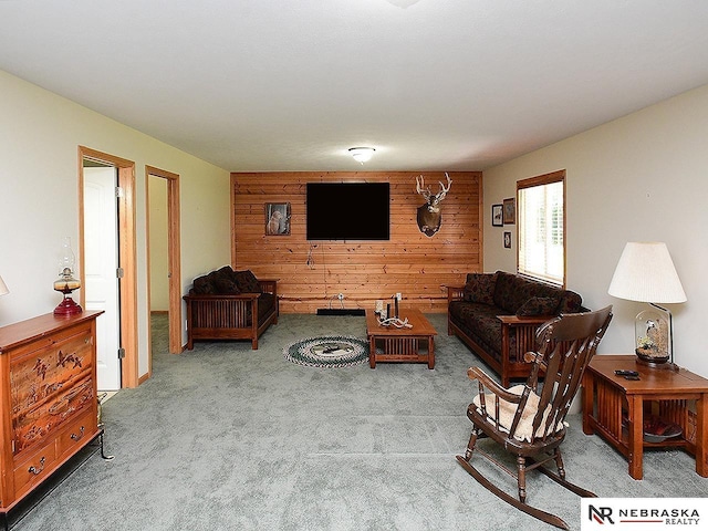 1853 SW 38th St, Lincoln, NE 68522 - carpeted living room featuring wood walls