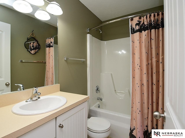 1853 SW 38th St, Lincoln, NE 68522 - bathroom featuring vanity, shower / bathtub combination with curtain, and toilet