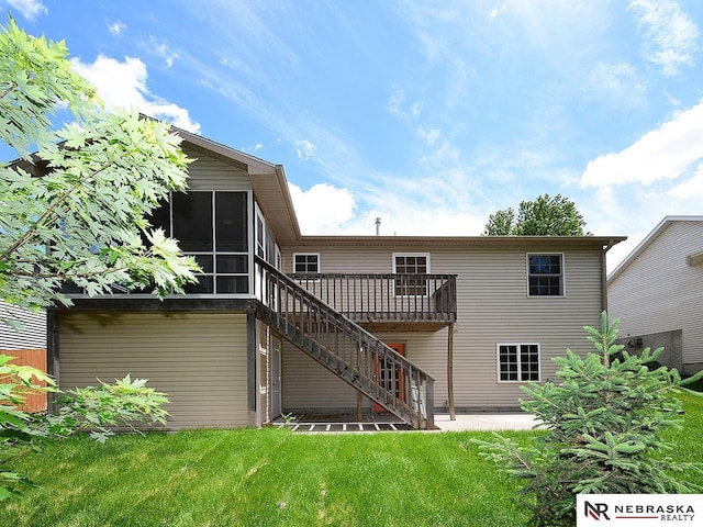 1853 SW 38th St, Lincoln, NE 68522 - rear view of house featuring stairway, a deck, a lawn, and a sunroom