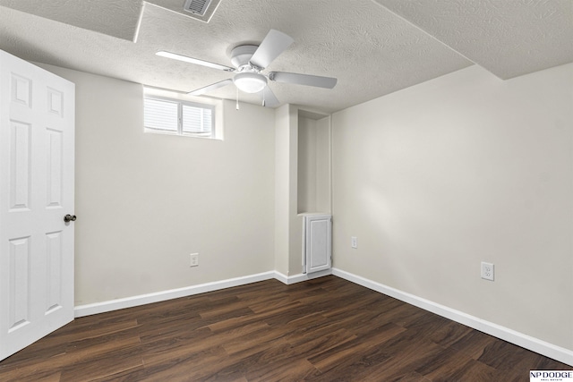 5435 S 18th St, Omaha, NE 68107 - spare room with dark wood-style floors, baseboards, a ceiling fan, and a textured ceiling
