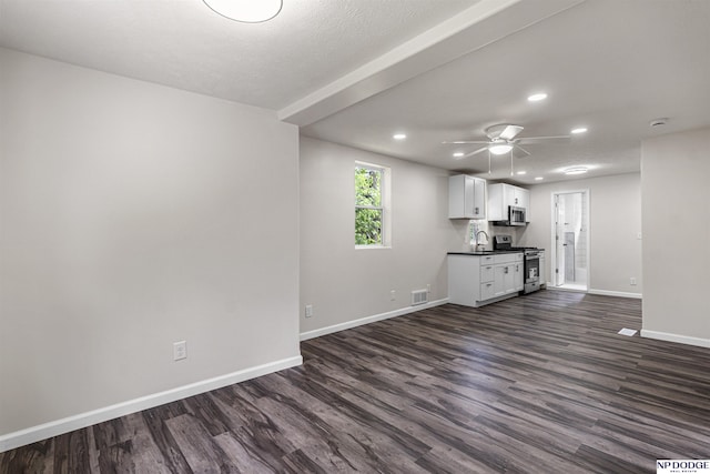 5435 S 18th St, Omaha, NE 68107 - unfurnished living room with recessed lighting, a sink, baseboards, dark wood-style flooring, and a ceiling fan