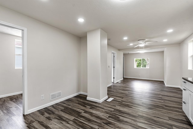 5435 S 18th St, Omaha, NE 68107 - empty room featuring dark wood-type flooring, baseboards, recessed lighting, and a ceiling fan