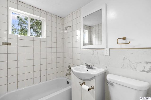 5435 S 18th St, Omaha, NE 68107 - full bath with toilet, vanity, tub / shower combination, tile walls, and tasteful backsplash
