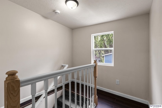 5437 S 18th St, Omaha, NE 68107 - stairway with baseboards and wood finished floors