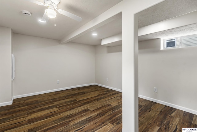5437 S 18th St, Omaha, NE 68107 - basement featuring dark wood-type flooring, baseboards, and a ceiling fan
