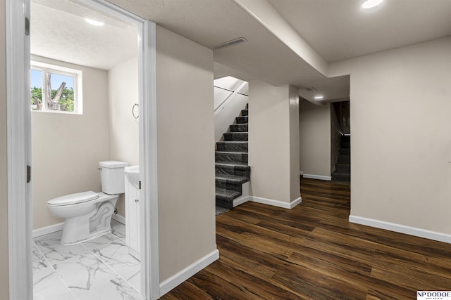 5437 S 18th St, Omaha, NE 68107 - bathroom with baseboards, toilet, and recessed lighting