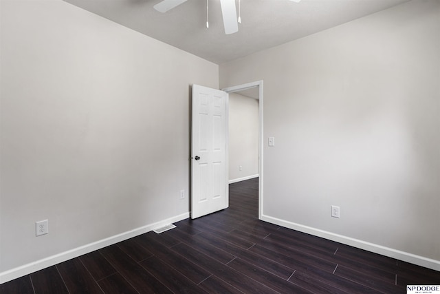 5437 S 18th St, Omaha, NE 68107 - unfurnished room with a ceiling fan, dark wood-type flooring, and baseboards