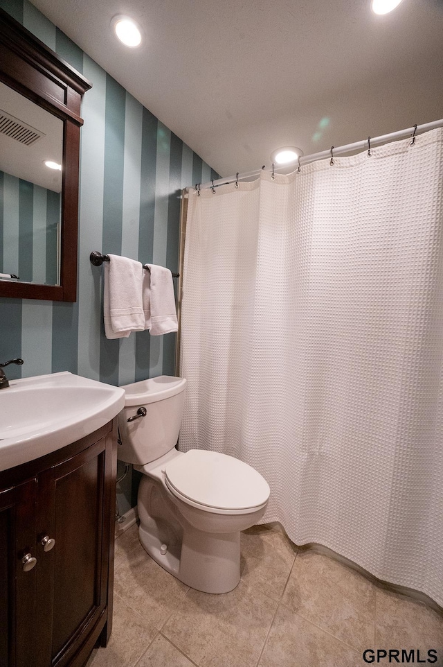 10755 Berry Plz, Omaha, NE 68127 - full bathroom with vanity, toilet, wallpapered walls, tile patterned flooring, and a shower with shower curtain
