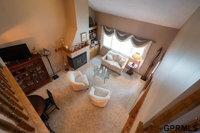 10755 Berry Plz, Omaha, NE 68127 - living area featuring a tile fireplace and carpet flooring