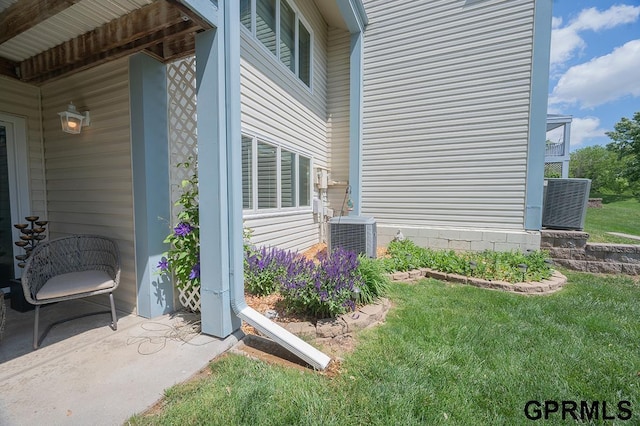 10755 Berry Plz, Omaha, NE 68127 - view of property exterior featuring central air condition unit and a lawn