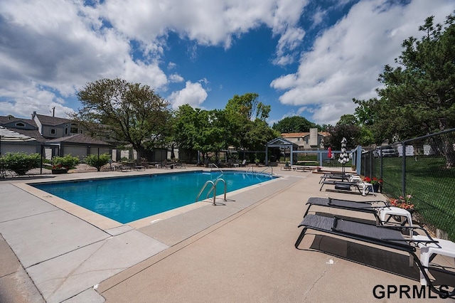 10755 Berry Plz, Omaha, NE 68127 - community pool with a patio area