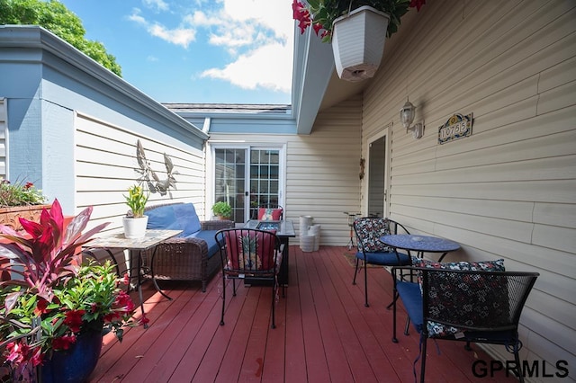 10755 Berry Plz, Omaha, NE 68127 - wooden deck featuring an outdoor living space
