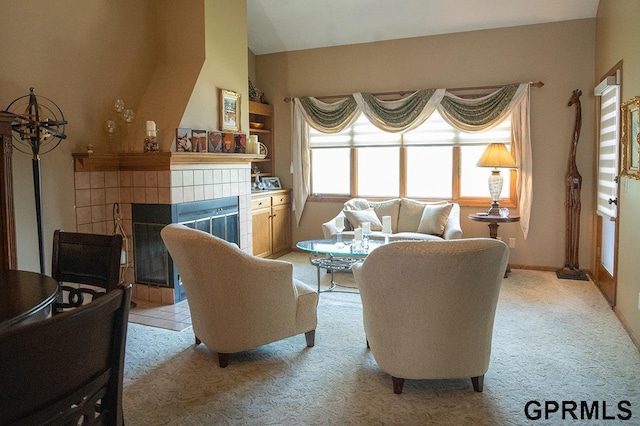 10755 Berry Plz, Omaha, NE 68127 - living area with light colored carpet and a fireplace