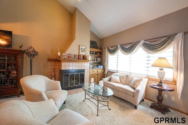 10755 Berry Plz, Omaha, NE 68127 - living area with a tiled fireplace, high vaulted ceiling, and baseboards