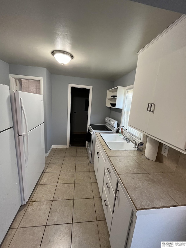 1152 N D St, Fremont, NE 68025 - kitchen featuring a sink, white appliances, open shelves, white cabinetry, and light tile patterned flooring
