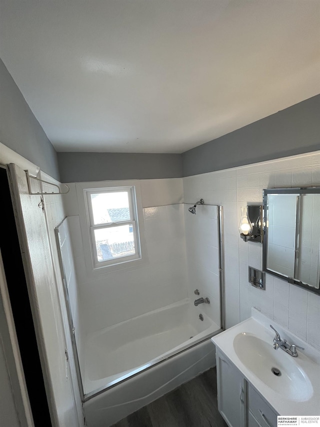 1152 N D St, Fremont, NE 68025 - bathroom featuring vanity, wood finished floors, and shower / tub combination