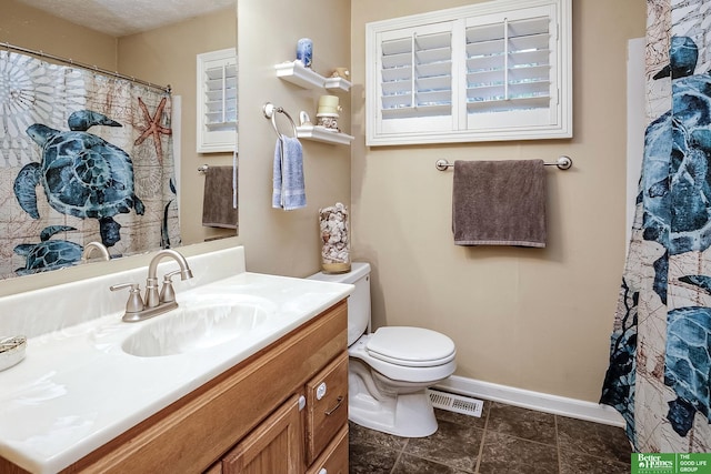 7535 S 76th St, La Vista, NE 68128 - full bath featuring vanity, toilet, baseboards, tile patterned flooring, and a shower with shower curtain