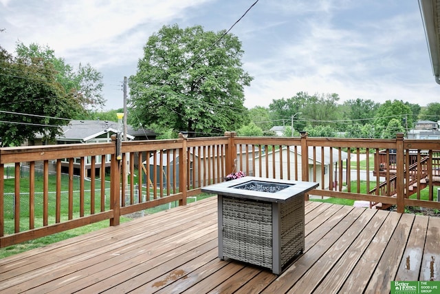 7535 S 76th St, La Vista, NE 68128 - wooden terrace featuring a fire pit and a lawn