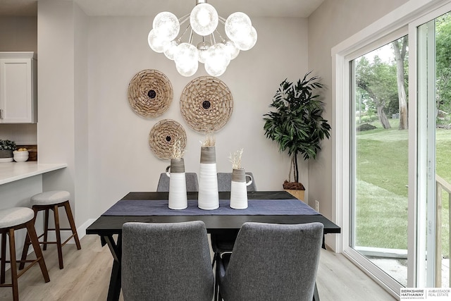 5445 S 51st St, Omaha, NE 68117 - dining room with light wood-style floors and a chandelier