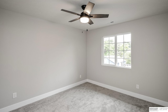 5445 S 51st St, Omaha, NE 68117 - carpeted spare room featuring baseboards and a ceiling fan