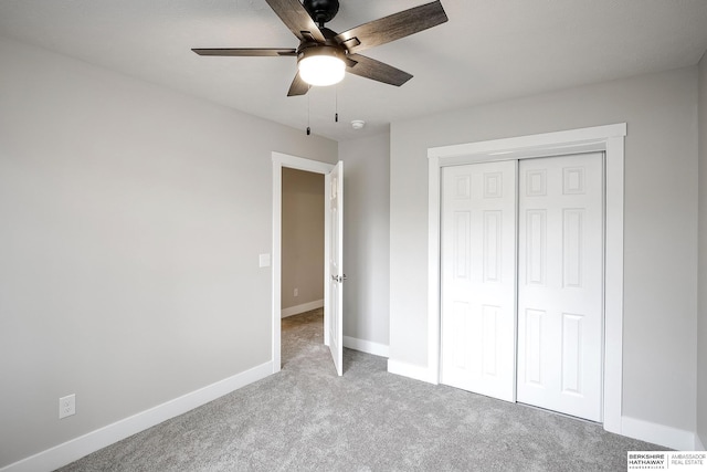 5445 S 51st St, Omaha, NE 68117 - unfurnished bedroom featuring carpet floors, a closet, baseboards, and ceiling fan