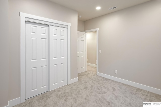 5445 S 51st St, Omaha, NE 68117 - unfurnished bedroom with carpet floors, baseboards, recessed lighting, and a closet