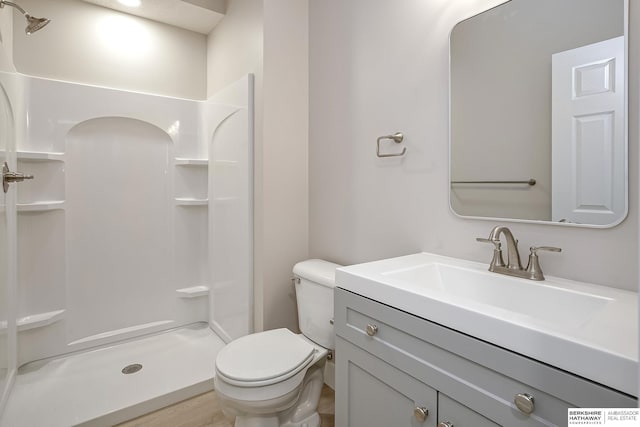 5445 S 51st St, Omaha, NE 68117 - bathroom with a stall shower, vanity, and toilet