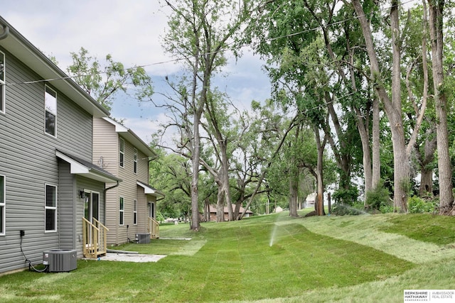 5445 S 51st St, Omaha, NE 68117 - view of grassy yard with entry steps and central AC unit