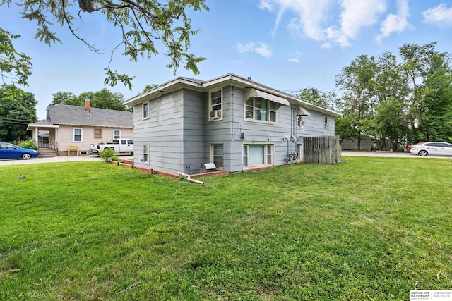 1136-1138 N D St, Fremont, NE 68025 - view of home's exterior featuring a lawn