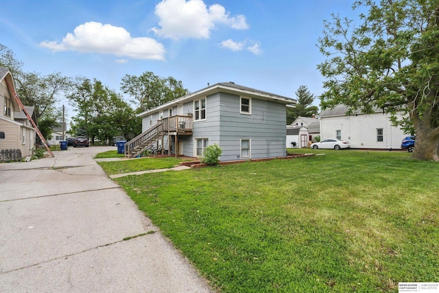 1136-1138 N D St, Fremont, NE 68025 - view of home's exterior featuring stairs and a lawn