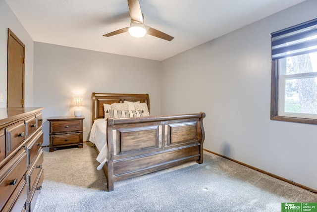 3209 Coffey Ave, Omaha, NE 68123 - bedroom featuring light carpet, baseboards, and ceiling fan