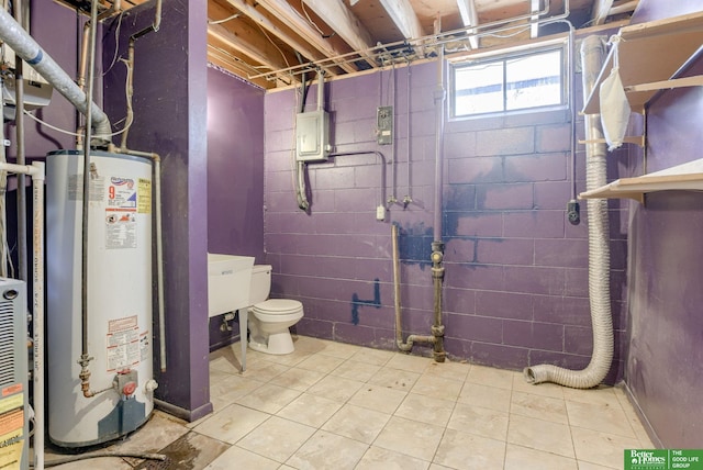 3209 Coffey Ave, Omaha, NE 68123 - basement with gas water heater, electric panel, tile patterned floors, and concrete block wall