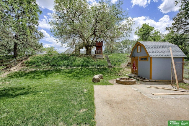 3209 Coffey Ave, Omaha, NE 68123 - view of yard featuring stairs and an outdoor fire pit
