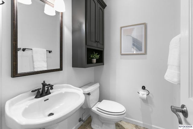 910 W Centennial Rd, Papillion, NE 68046 - half bathroom with a sink, toilet, and baseboards