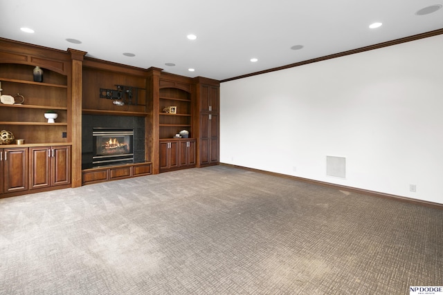 910 W Centennial Rd, Papillion, NE 68046 - unfurnished living room with ornamental molding, a glass covered fireplace, carpet flooring, baseboards, and recessed lighting